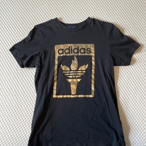 Adidas black and gold flame logo tee